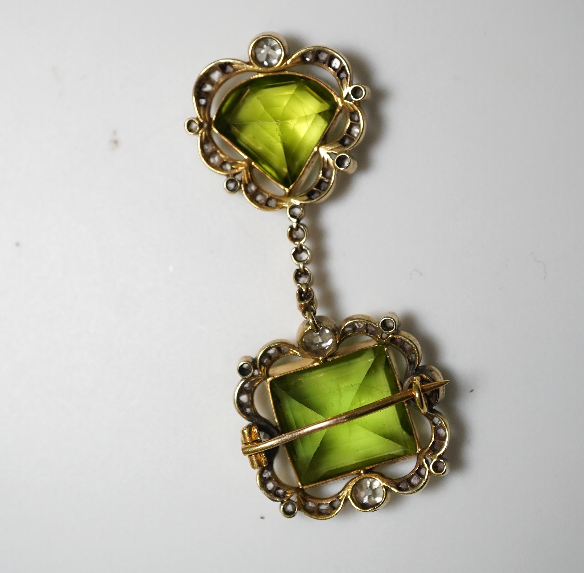 A peridot and diamond brooch, circa 1900